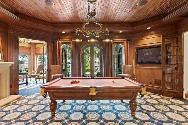 a view of a balcony with furniture and wooden floor