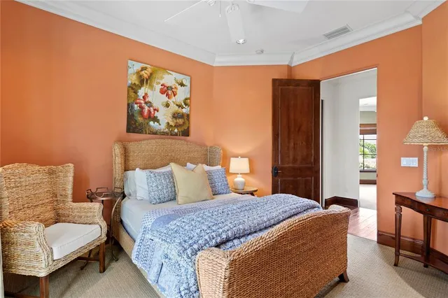 a view of a patio with table and chairs potted plants and palm trees