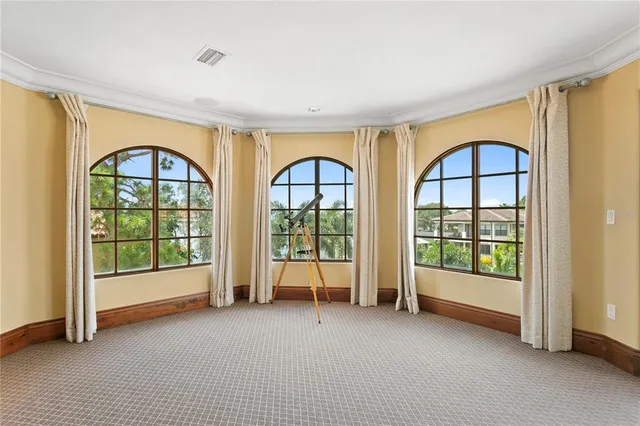 a view of a house with swimming pool and a garden
