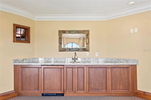 a view of a white house with a large pool and a outdoor view