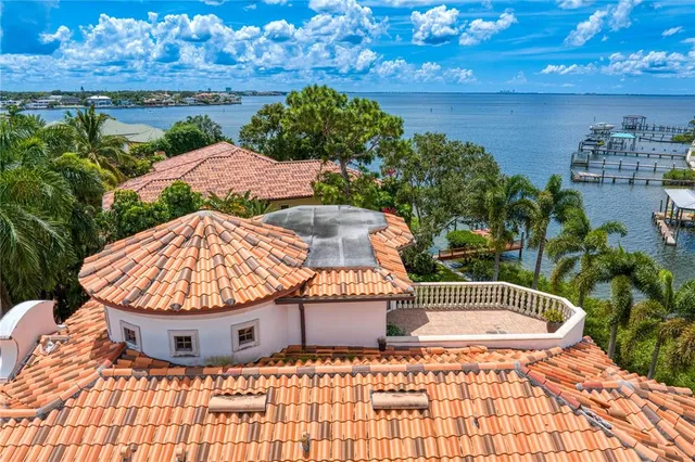 a view of a house with patio and a garden