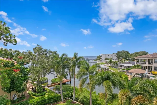 a view of a two chairs and table in the balcony