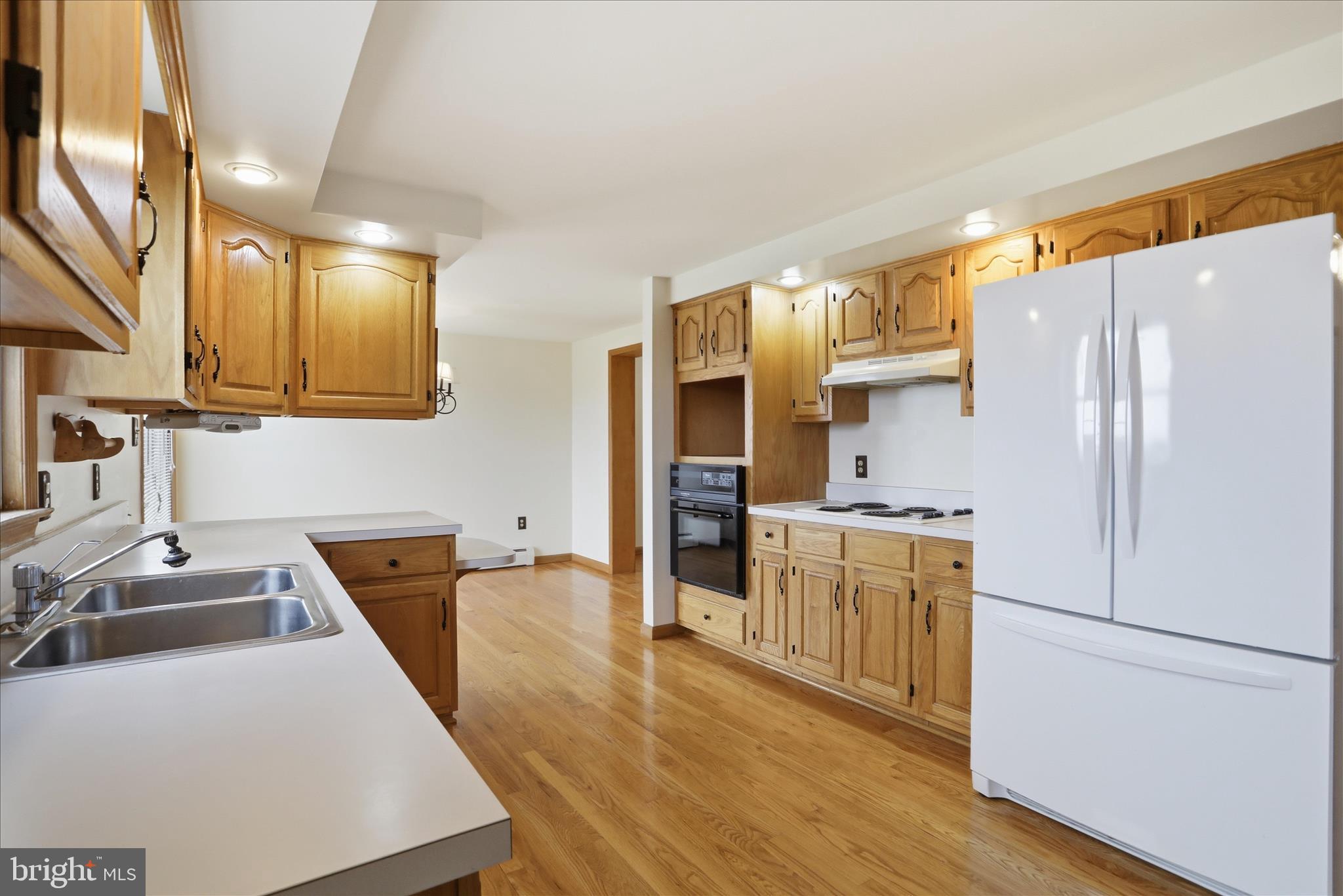 529 Braddock School Road Slanesville, WV 25444 - Photo 13 of 44 a kitchen with stainless steel appliances granite countertop a refrigerator a stove and a sink