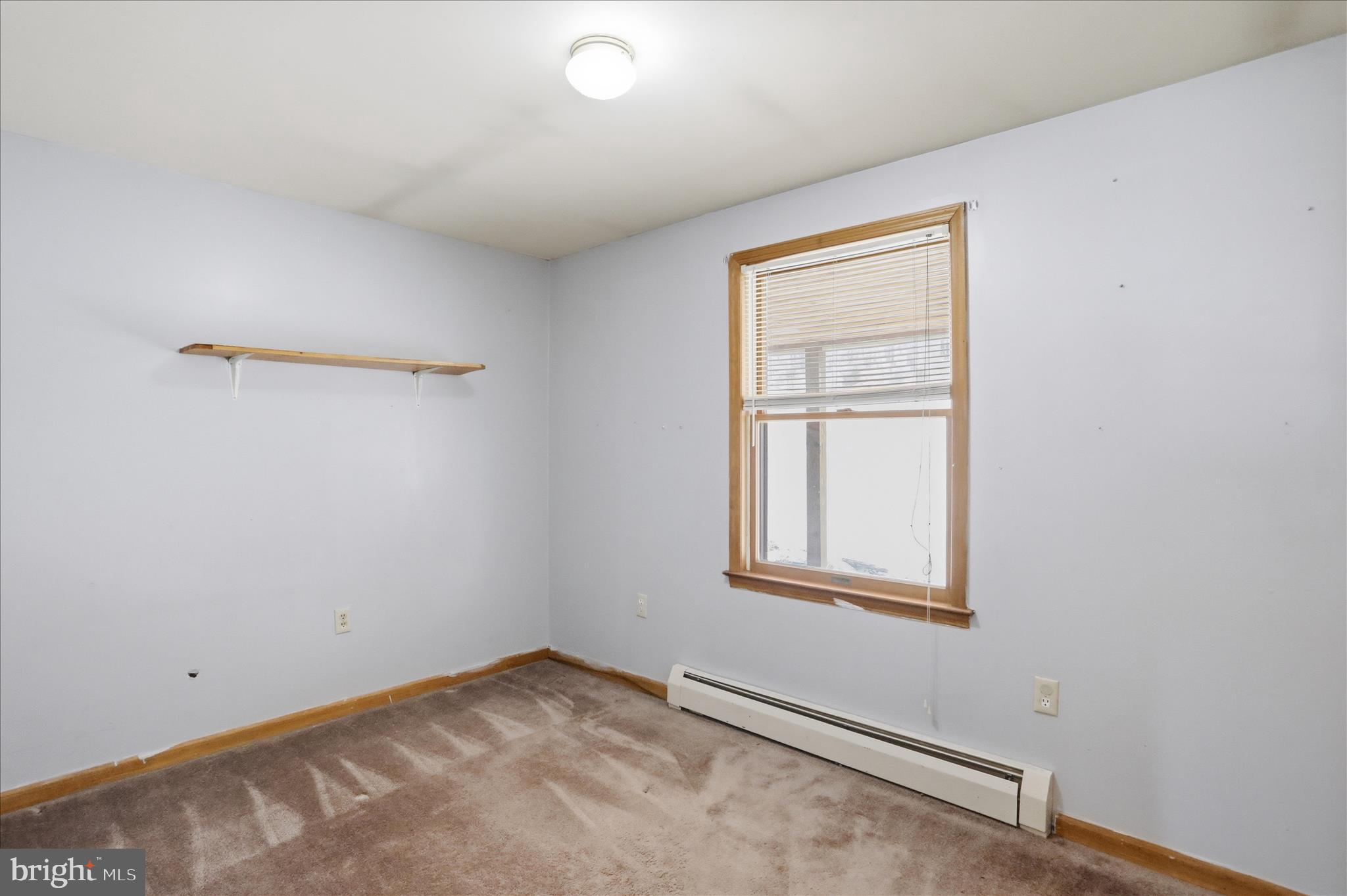 529 Braddock School Road Slanesville, WV 25444 - Photo 16 of 44 an empty room with a window