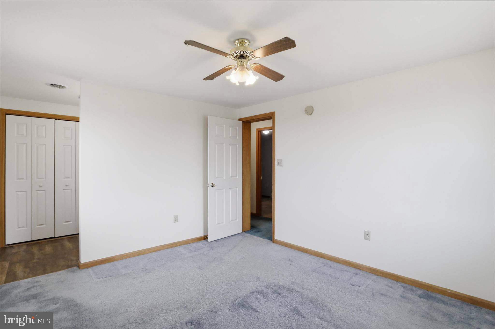 529 Braddock School Road Slanesville, WV 25444 - Photo 20 of 44 a view of an empty room with a ceiling fan