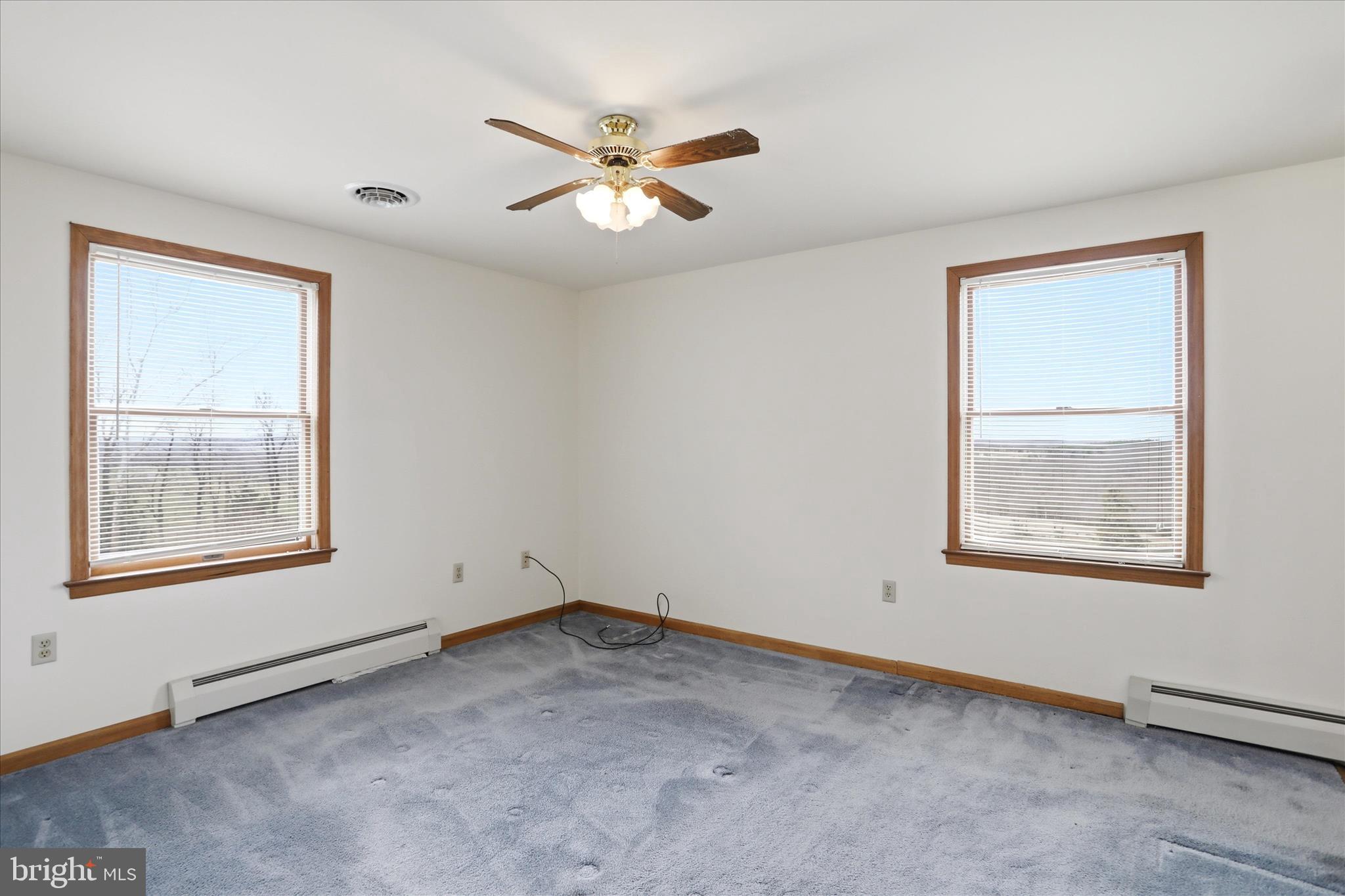 529 Braddock School Road Slanesville, WV 25444 - Photo 21 of 44 an empty room with a window