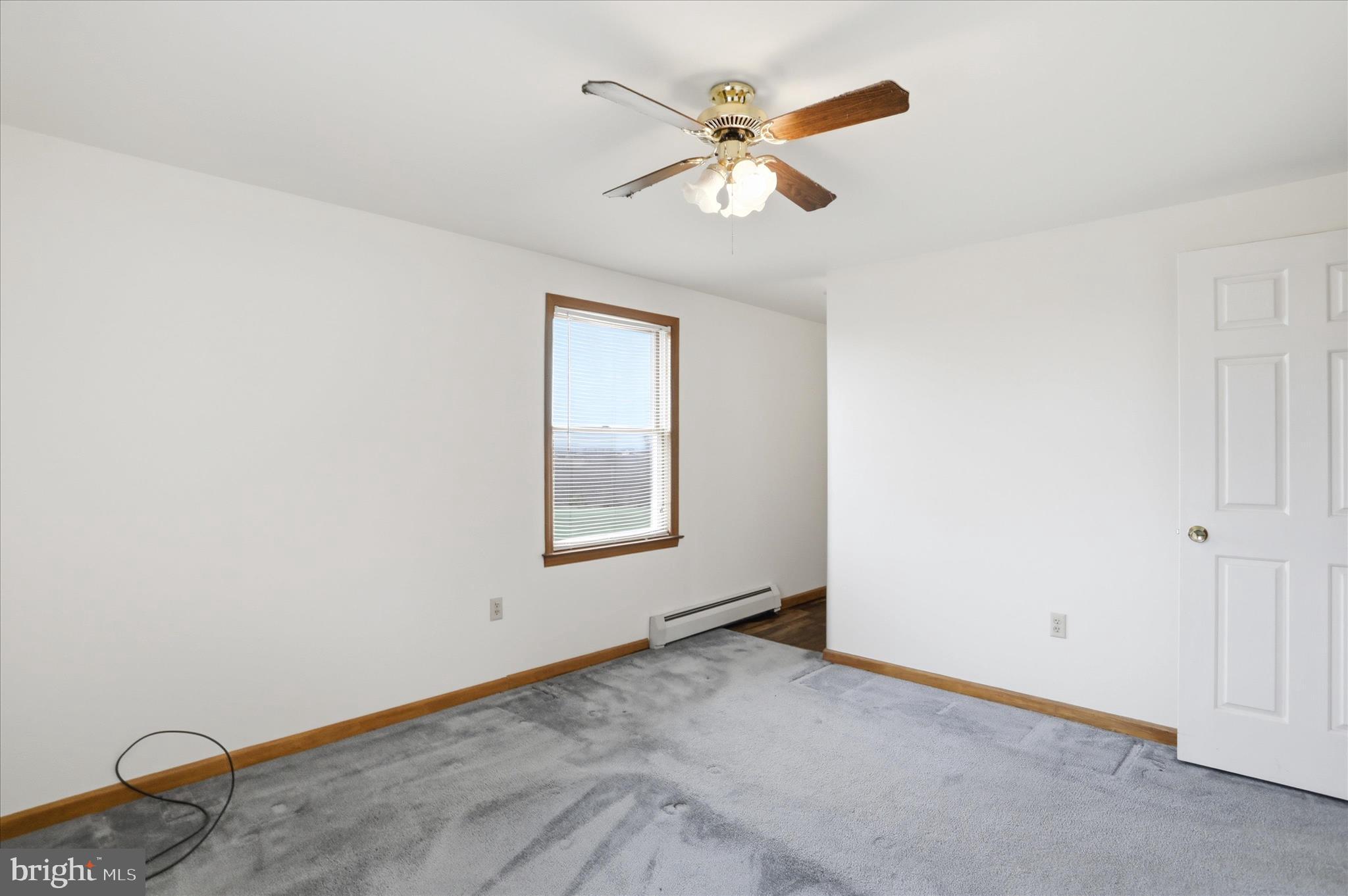 529 Braddock School Road Slanesville, WV 25444 - Photo 22 of 44 an empty room with a window