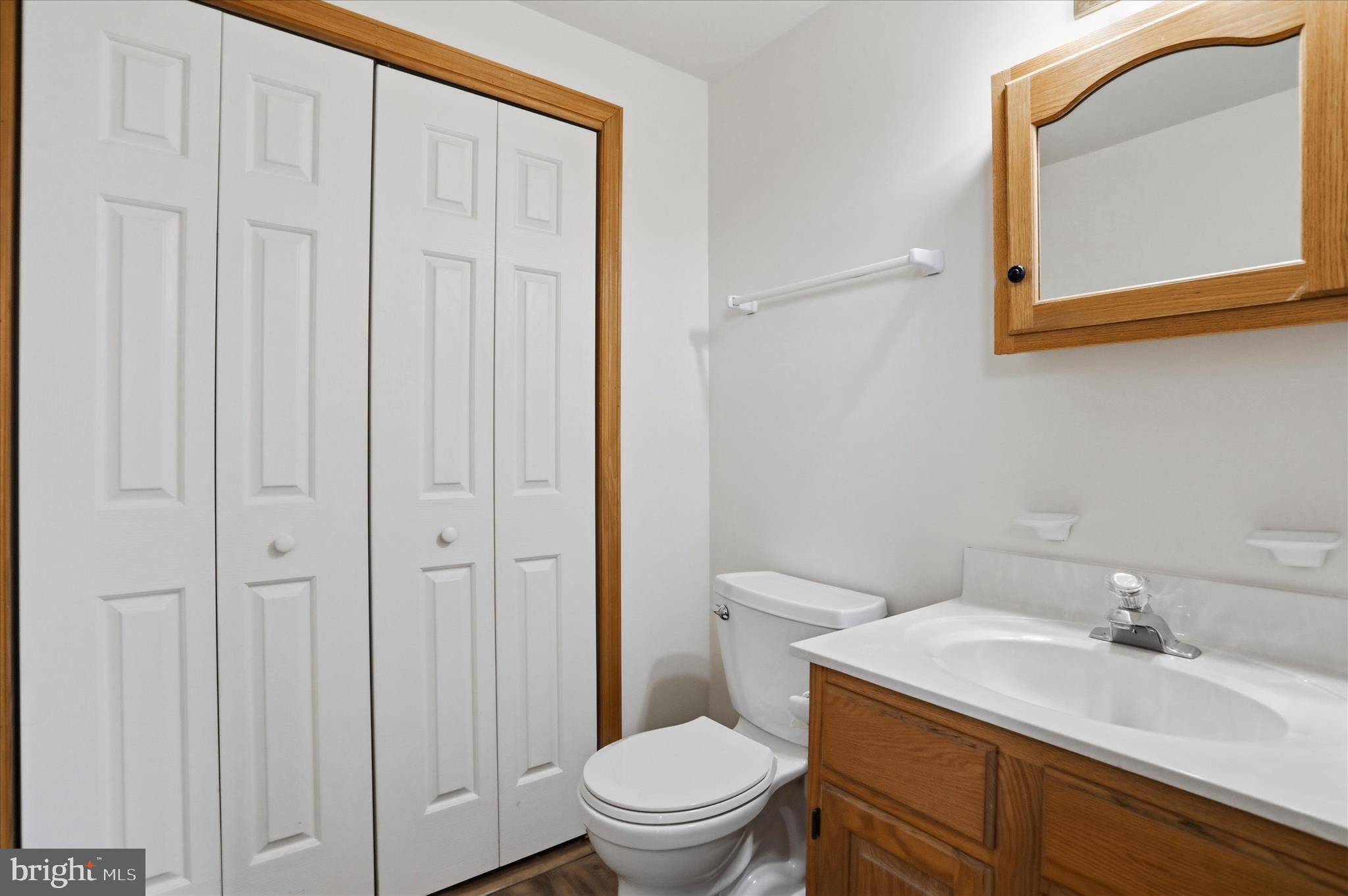 529 Braddock School Road Slanesville, WV 25444 - Photo 23 of 44 a bathroom with a sink a toilet and a mirror