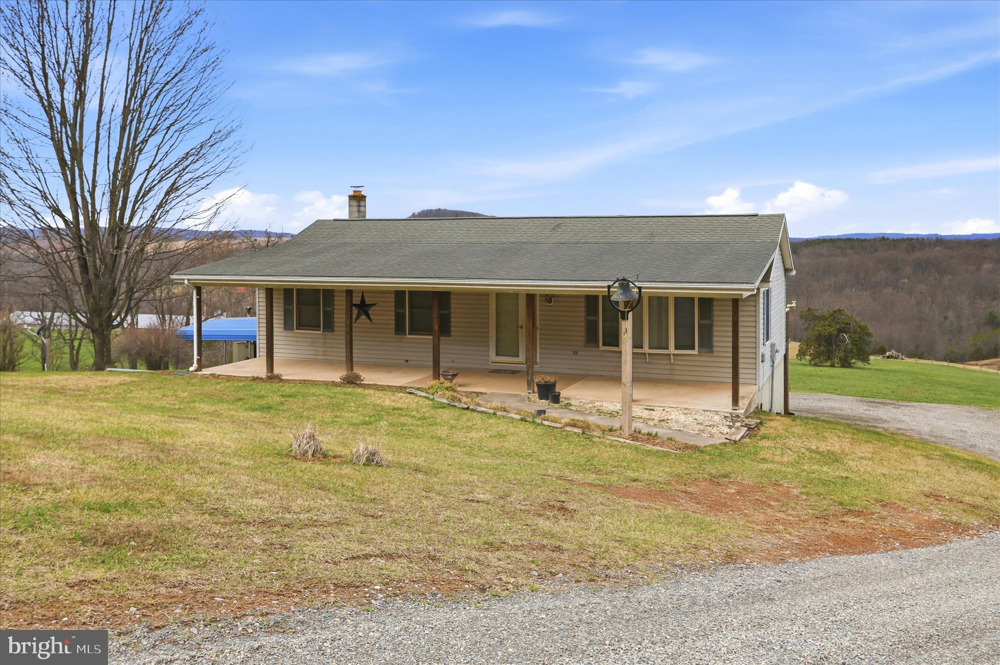 529 Braddock School Road Slanesville, WV 25444 - Photo 43 of 44 a front view of a house with a garden