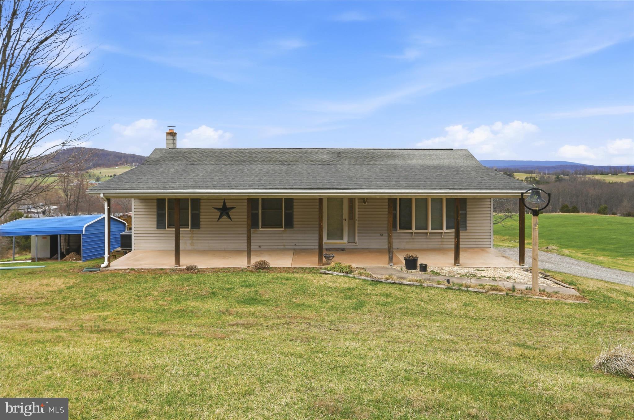 529 Braddock School Road Slanesville, WV 25444 - Photo 6 of 44 a front view of a house with a yard