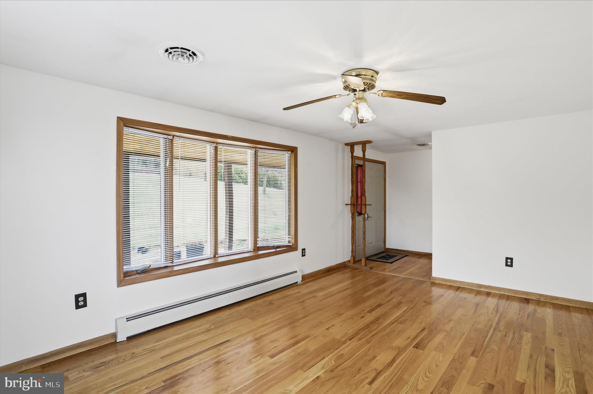 529 Braddock School Road Slanesville, WV 25444 - Photo 7 of 44 a view of an empty room with a window