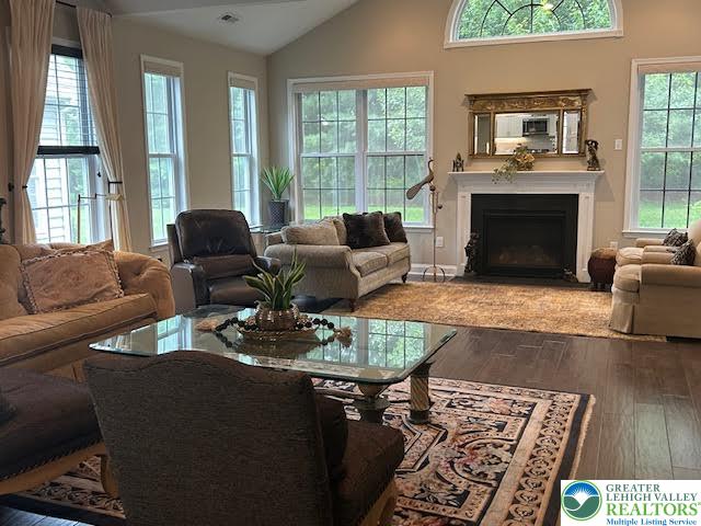 1051 Resolution Drive Bethlehem, PA 18017 - Photo 16 of 33 a living room with furniture a large window and a fireplace