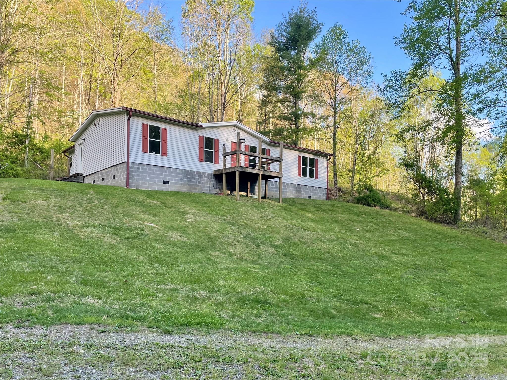 784 Fred Holcombe Road Mars Hill, NC 28754 - Photo 1 of 35 a house view with a outdoor space