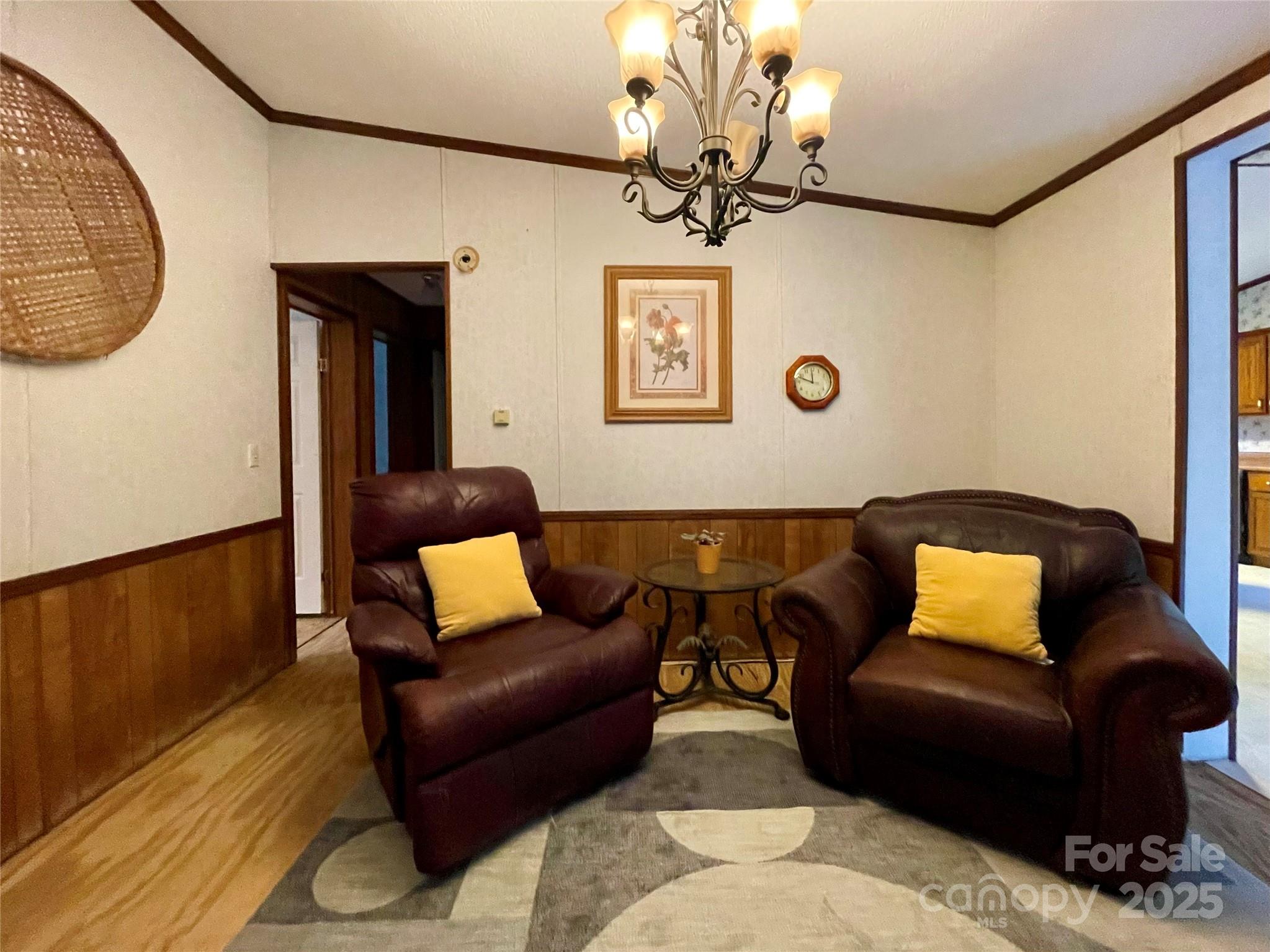 784 Fred Holcombe Road Mars Hill, NC 28754 - Photo 20 of 35 a living room with furniture and a wooden floor