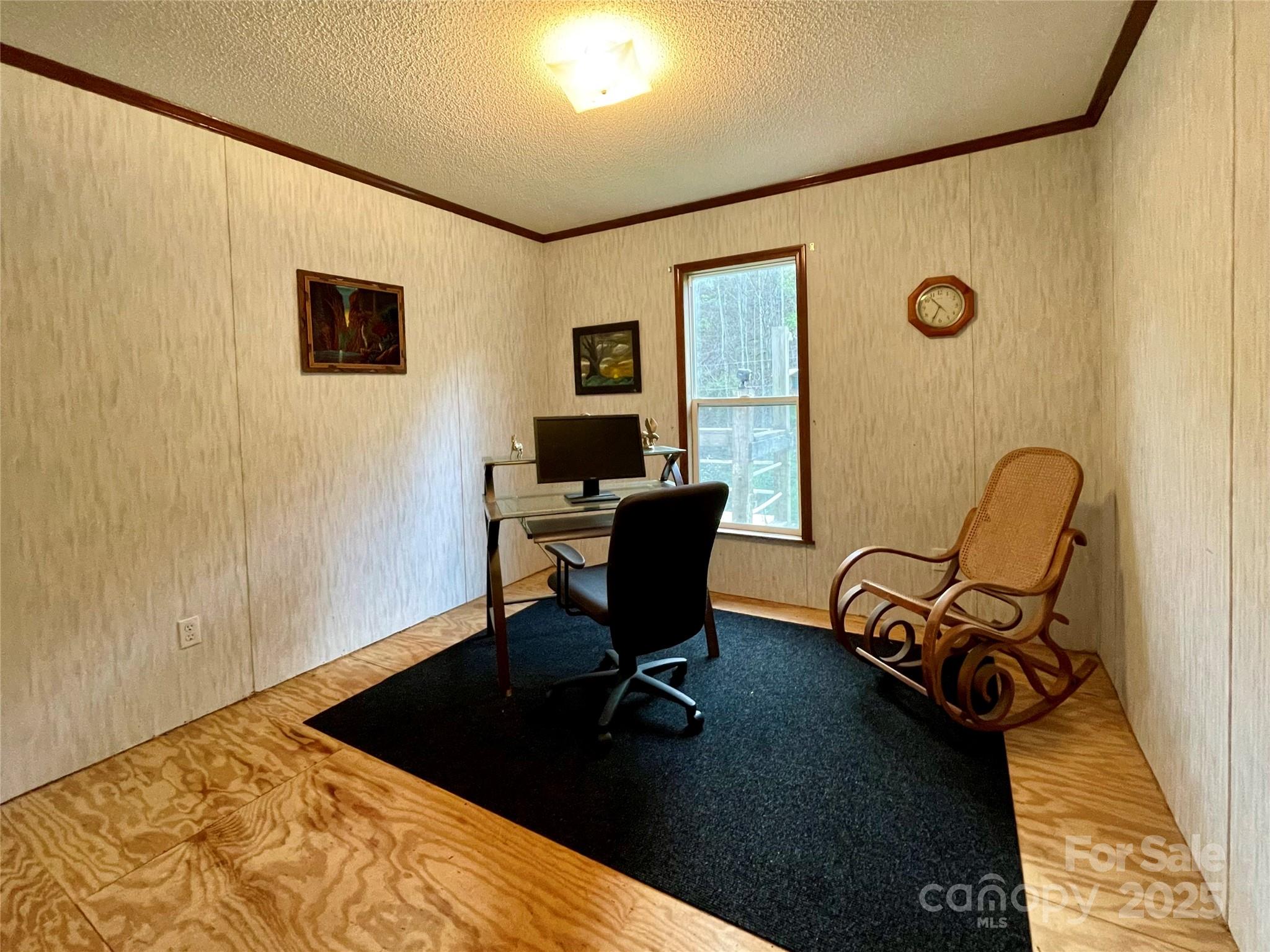 784 Fred Holcombe Road Mars Hill, NC 28754 - Photo 21 of 35 a view of a workspace with furniture and a window