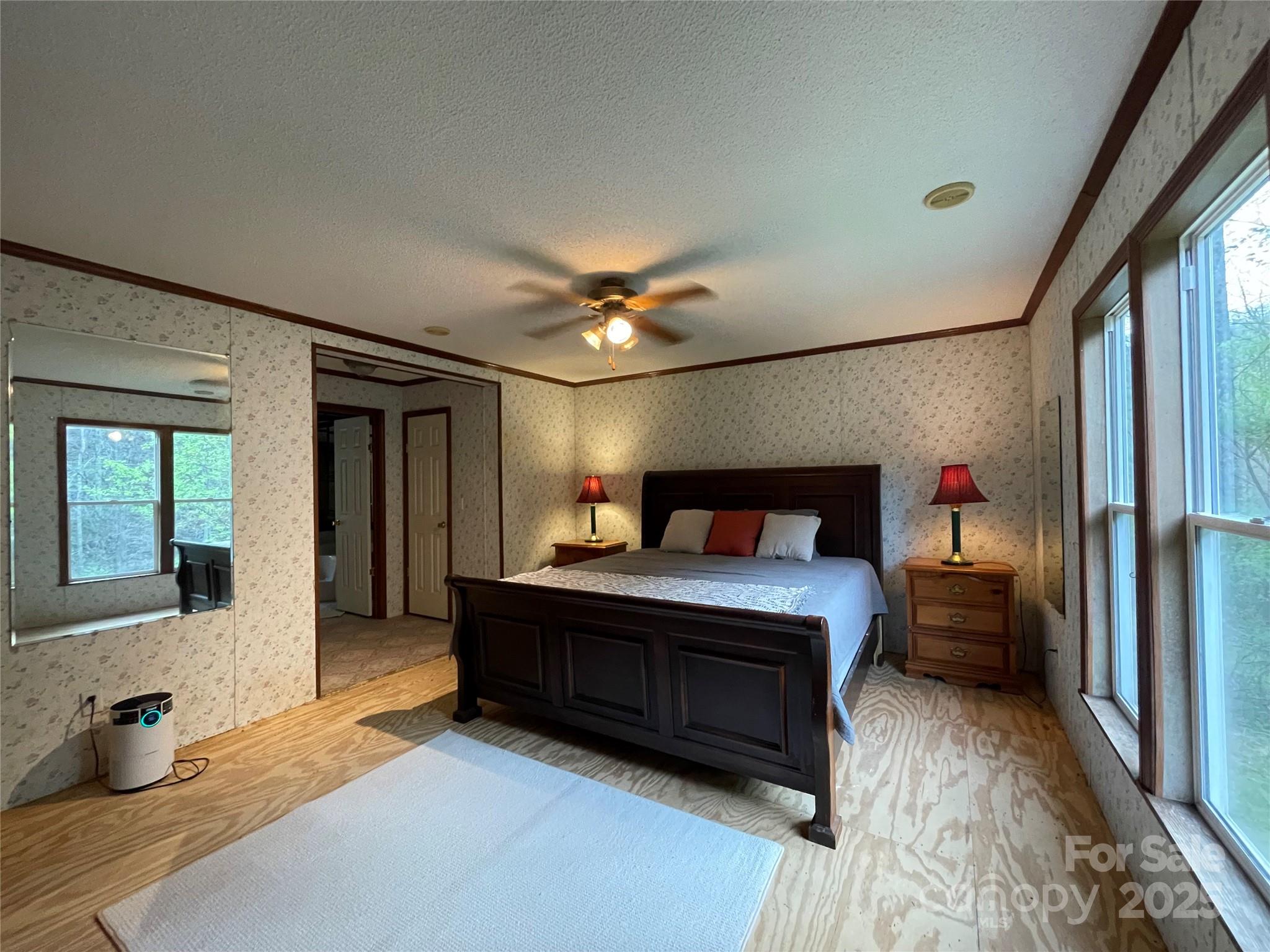 784 Fred Holcombe Road Mars Hill, NC 28754 - Photo 26 of 35 a bedroom with a bed and a large window