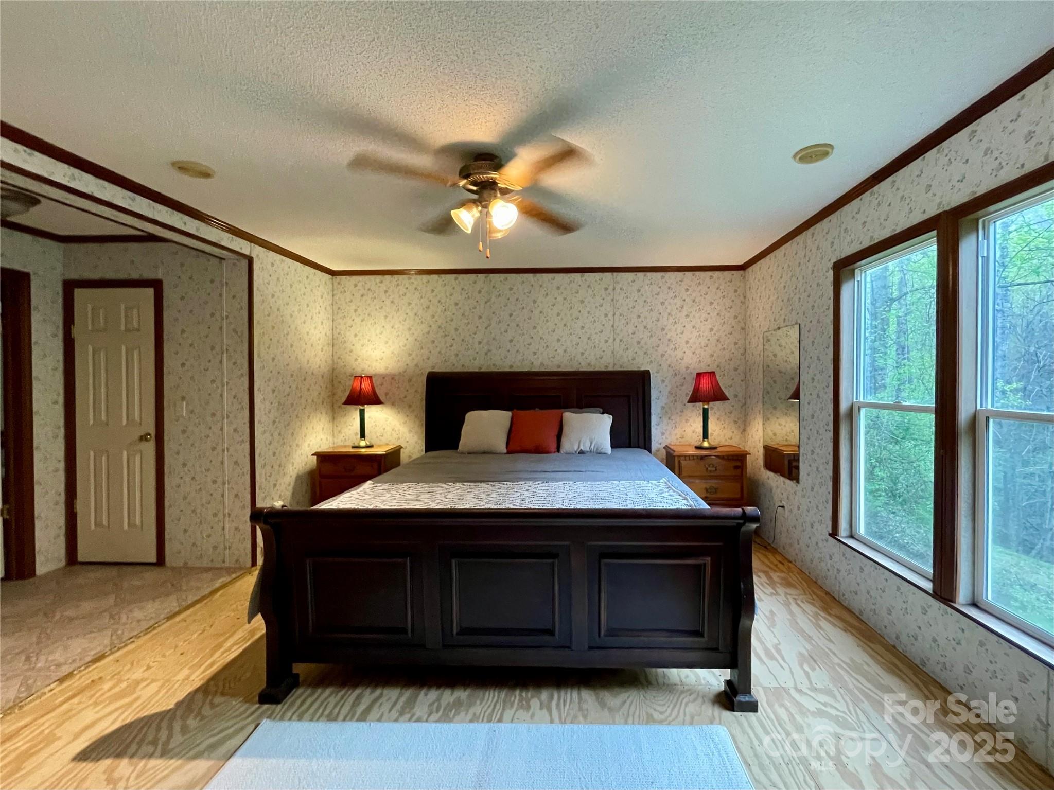 784 Fred Holcombe Road Mars Hill, NC 28754 - Photo 27 of 35 a bedroom with a bed and a large window
