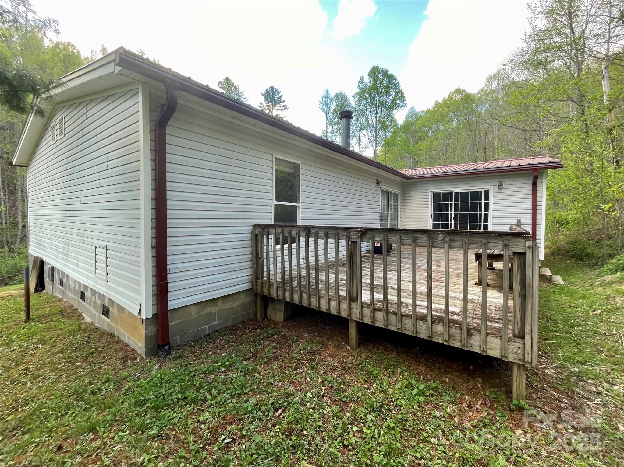 784 Fred Holcombe Road Mars Hill, NC 28754 - Photo 7 of 35 a view of a house with wooden fence