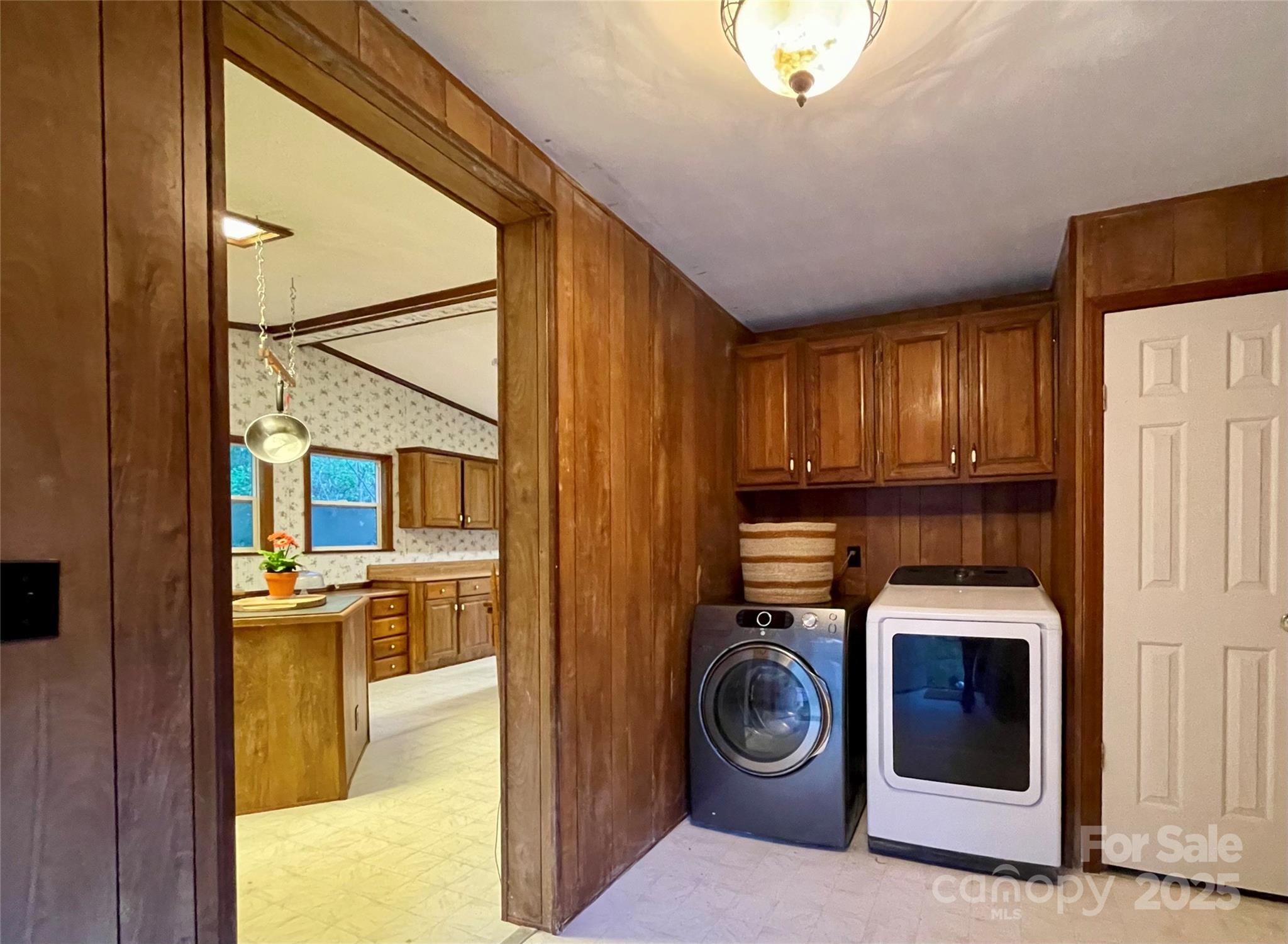 784 Fred Holcombe Road Mars Hill, NC 28754 - Photo 9 of 35 a view of a hallway with washer and dryer
