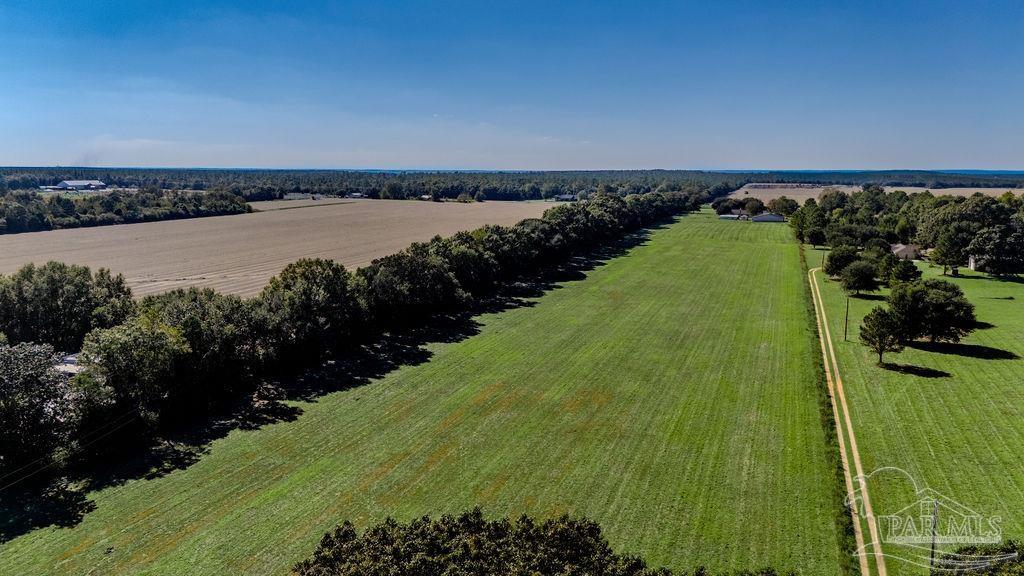 4 A Tidwell Road Pace, FL 32571 - Photo 8 of 13 a view of a lake with a outdoor space