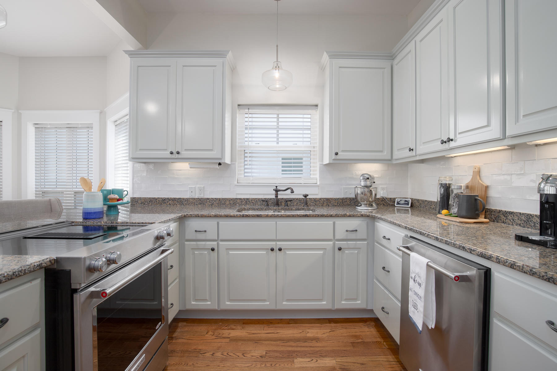 44 Grande Pointe Drive Inlet Beach, FL 32461 - Photo 11 of 32 a kitchen with white cabinets appliances a sink and a window