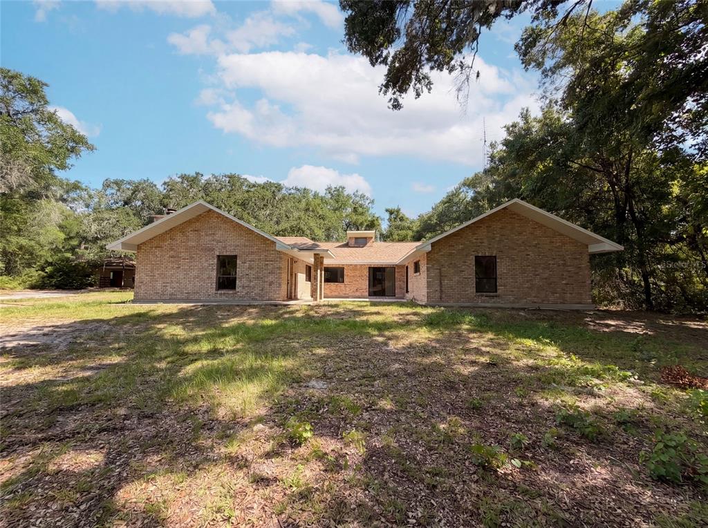 3739 Lake Griffin Road Lady Lake, FL 32159 - Photo 1 of 21 a view of a yard with a house