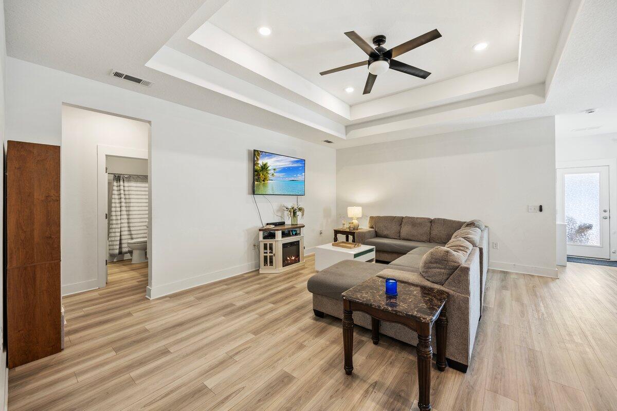 211 Lyla Lane Crestview, FL 32539 - Photo 11 of 38 a living room with furniture and wooden floor