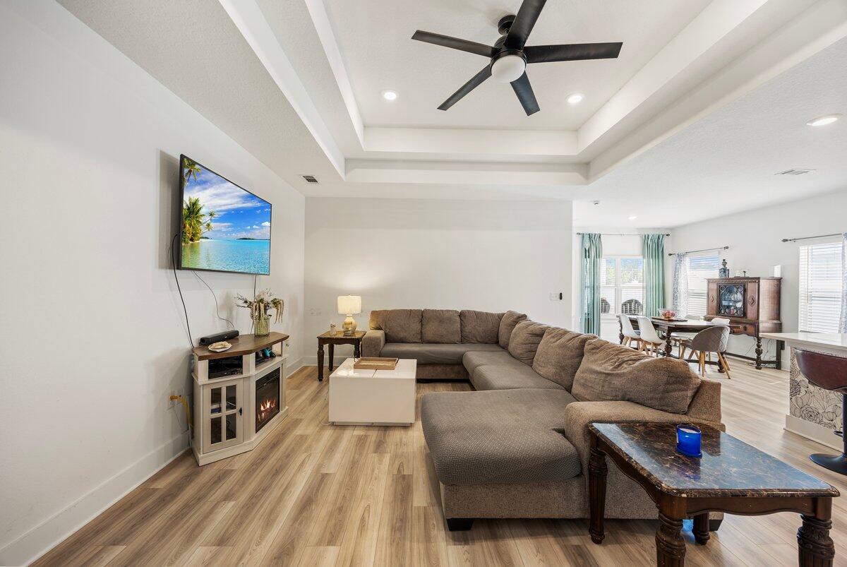 211 Lyla Lane Crestview, FL 32539 - Photo 13 of 38 a living room with furniture and a flat screen tv