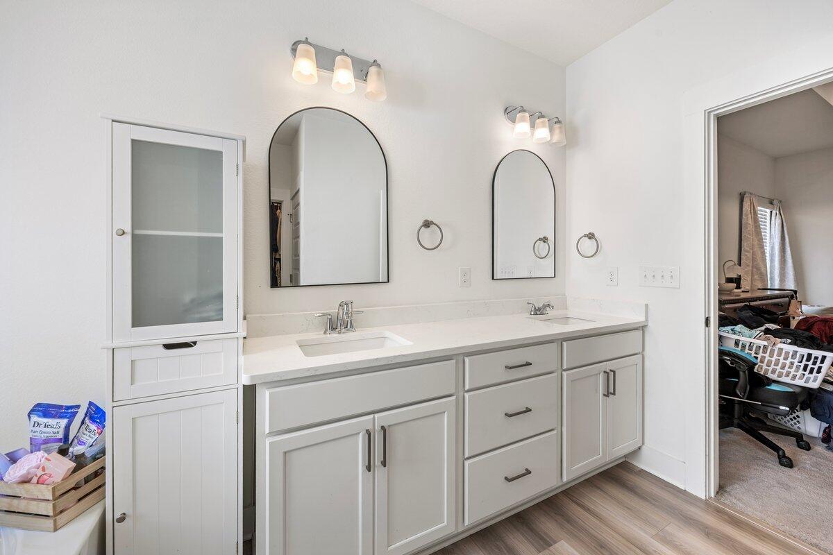 211 Lyla Lane Crestview, FL 32539 - Photo 22 of 38 a bathroom with 2 sink and a mirror