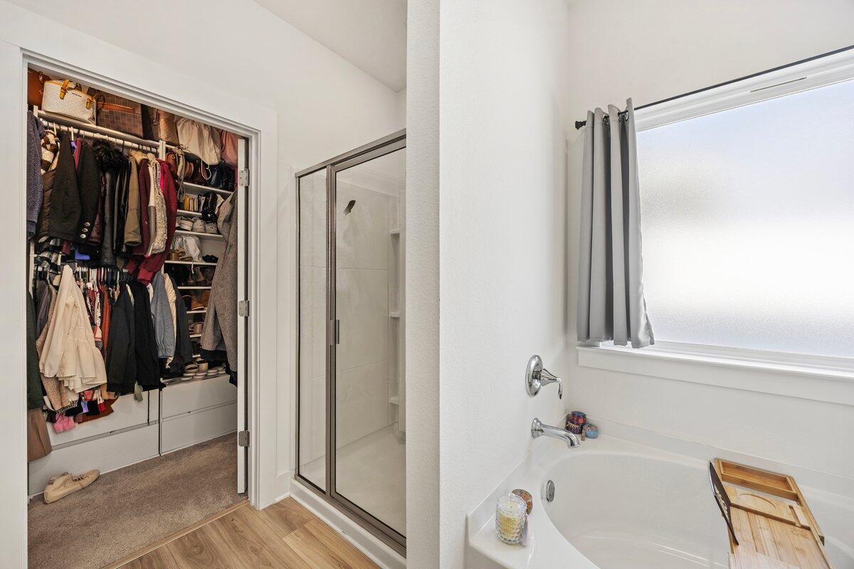 211 Lyla Lane Crestview, FL 32539 - Photo 23 of 38 a view of walk in closet with clothes and shoes