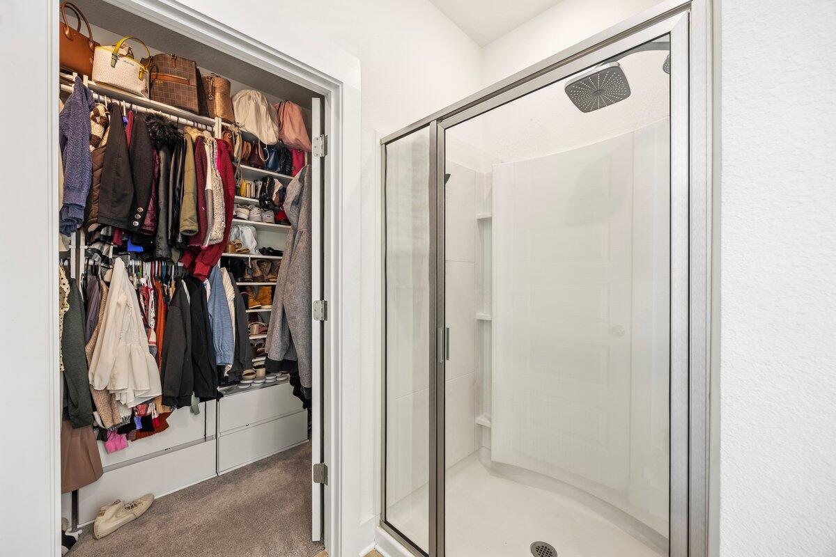211 Lyla Lane Crestview, FL 32539 - Photo 24 of 38 a view of walk in closet with clothes