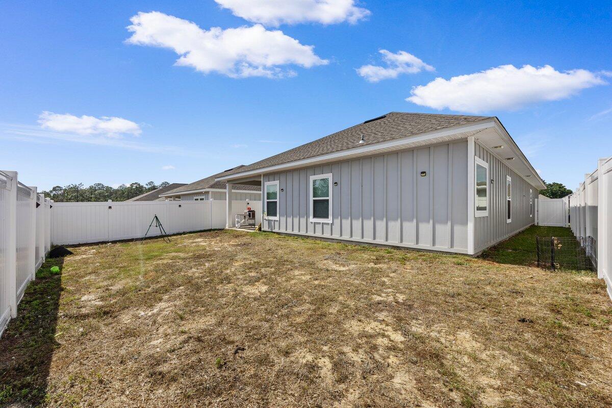 211 Lyla Lane Crestview, FL 32539 - Photo 25 of 38 a view of a house with a backyard