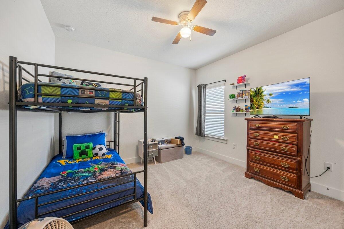 211 Lyla Lane Crestview, FL 32539 - Photo 27 of 38 a bedroom with a bunk bed and a dresser