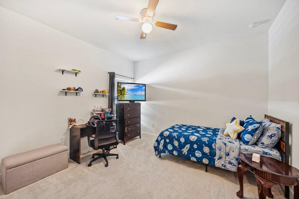 211 Lyla Lane Crestview, FL 32539 - Photo 28 of 38 a livingroom with toys and a chair