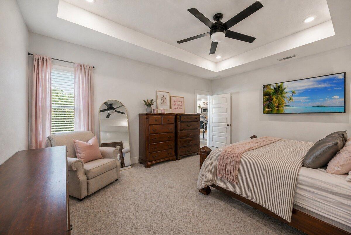 211 Lyla Lane Crestview, FL 32539 - Photo 31 of 38 a spacious bedroom with a bed and ceiling fan