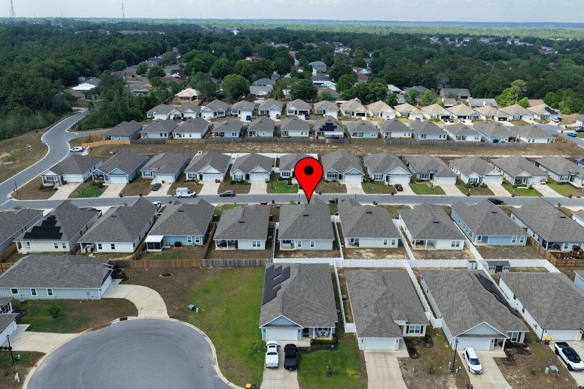 211 Lyla Lane Crestview, FL 32539 - Photo 36 of 38 an aerial view of a houses with a swimming pool