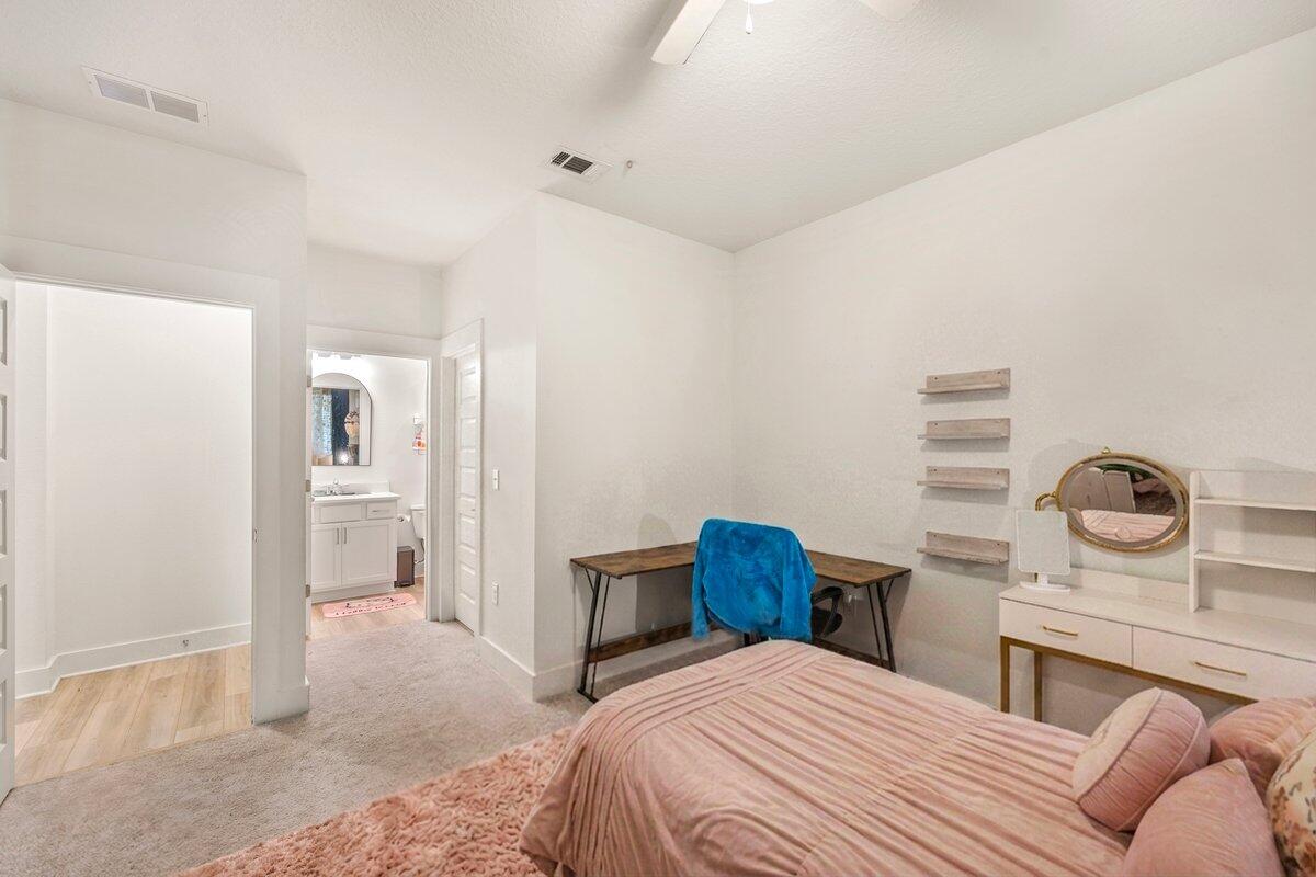 211 Lyla Lane Crestview, FL 32539 - Photo 5 of 38 a bedroom with a bed and a table