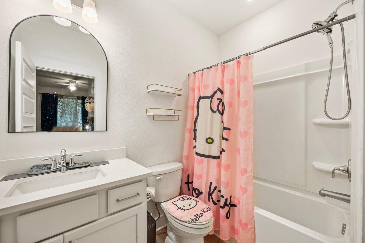211 Lyla Lane Crestview, FL 32539 - Photo 6 of 38 a bathroom with a sink a toilet and a bathtub