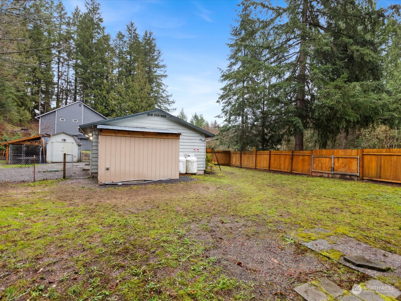 18101 Trombley Road Snohomish, WA 98290 - Photo 23 of 27 a backyard of a house with lots of green space
