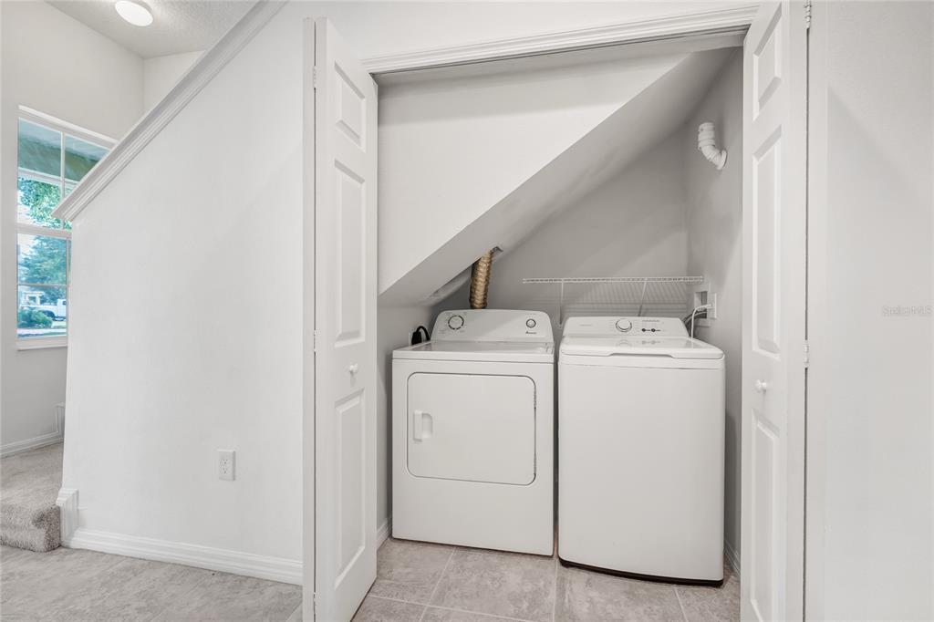 4824 Poolside Drive St. Cloud, FL 34769 - Photo 16 of 29 a utility room with dryer and washer