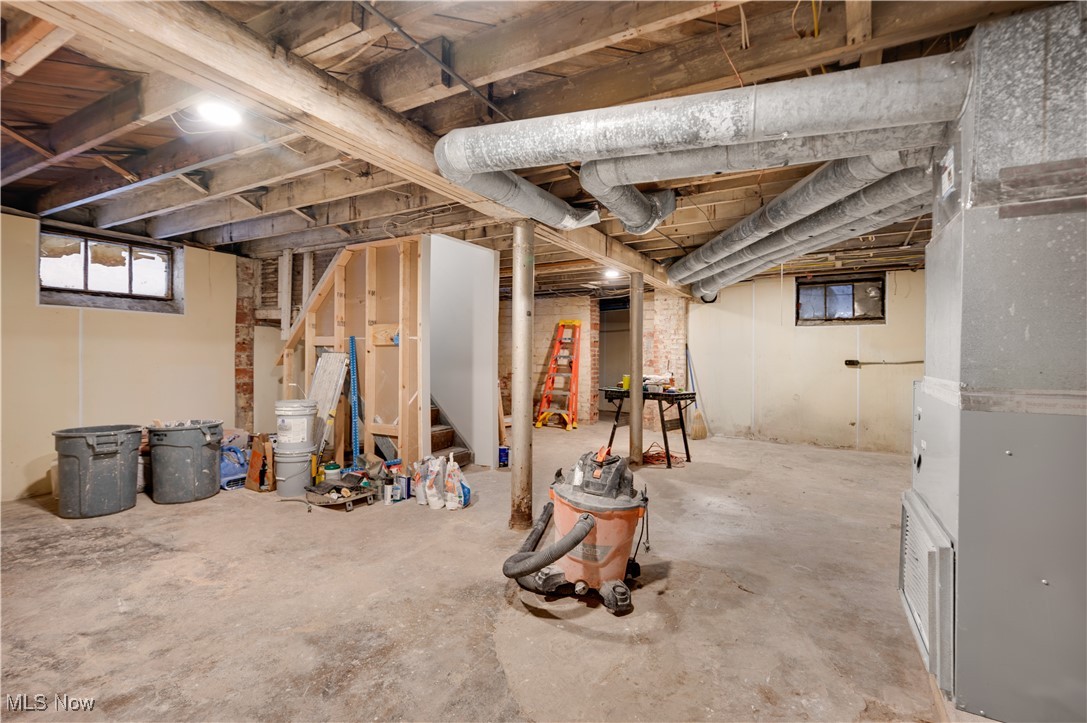 2016 Rossmoor Road Cleveland Heights, OH 44118 - Photo 40 of 46 Basement featuring stairs and heating unit