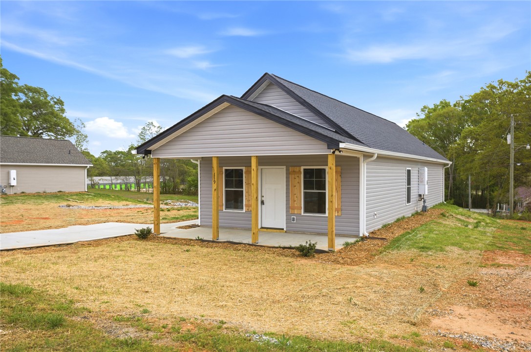 119 Riley Street Westminster, SC 29693 - Photo 3 of 44 This newly constructed residence offers a welcoming facade with a covered porch.