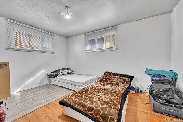 a bedroom with bed and a couch