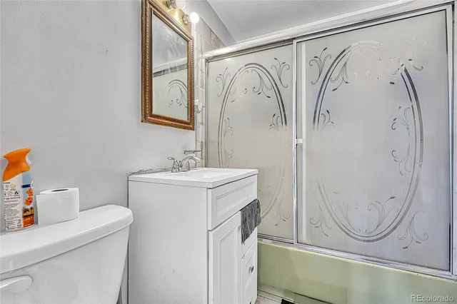 a bathroom with a sink a mirror and a shower