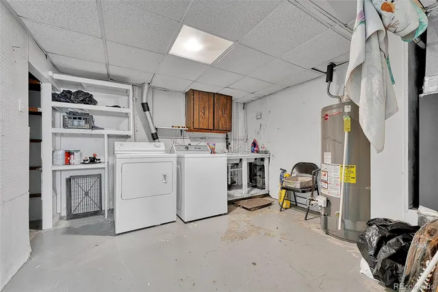 a view of storage and utility room with washer and dryer