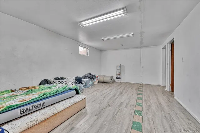 a hallway with a bed and a couch