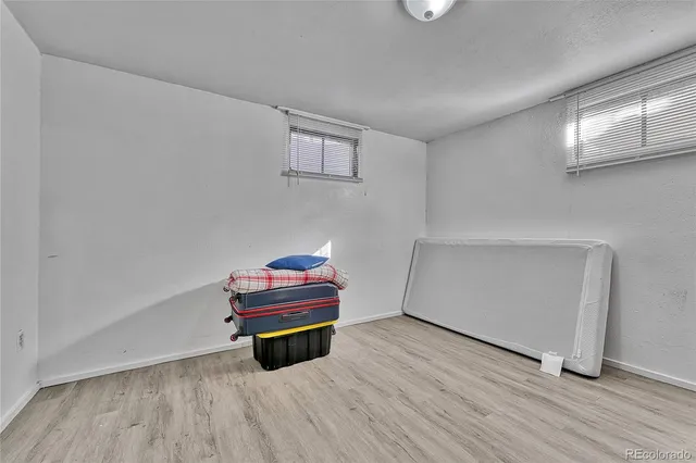 a room with toys and wooden floor