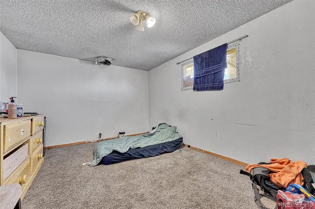 a view of yard covered with snow in front of house