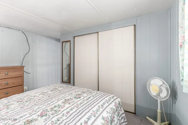 a bed room with a bed and a window