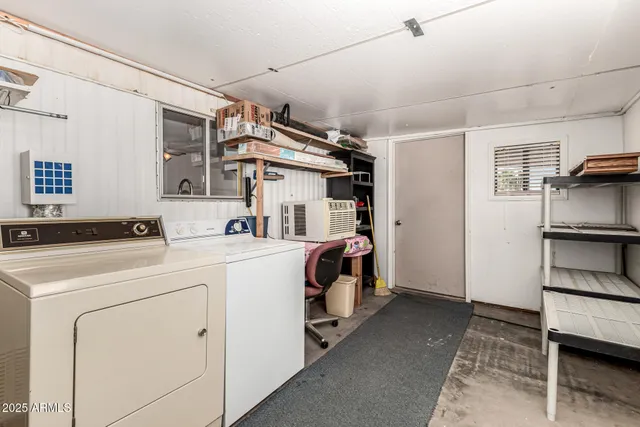 a palm tree sitting in front of a house with a yard